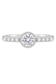A silver-tone diamond engagement ring with a round-cut center stone in a halo setting, flanked by small side stones on a plain white background.