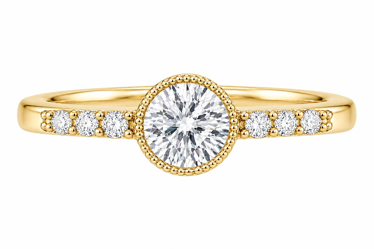 A yellow gold ring featuring a large round brilliant-cut center stone in a beaded halo setting, with smaller round stones set along the shoulders, shown on a plain white background.