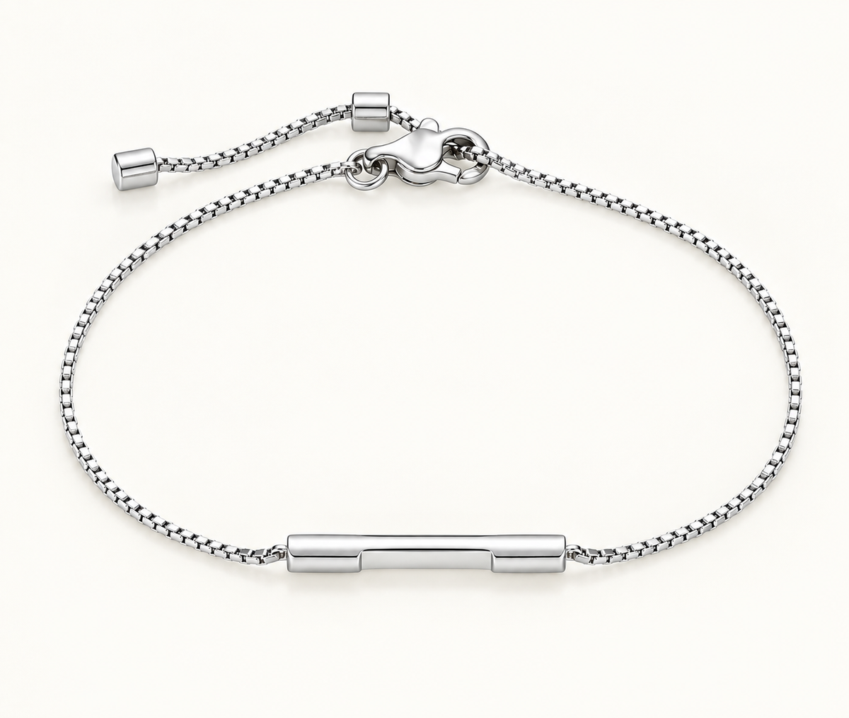 A silver chain bracelet with a central polished bar and adjustable clasp, shown on a clean off-white background.