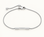 A silver chain bracelet with a central polished bar and adjustable clasp, shown on a clean off-white background.