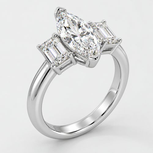 Three stone marquise and emerald cut diamond engagement ring in white gold