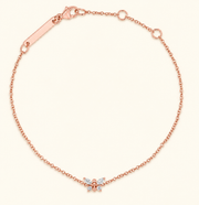 Macro view of a rose gold diamond butterfly bracelet with 3 × 1.5 mm marquise diamonds and 1.7 mm round diamonds.