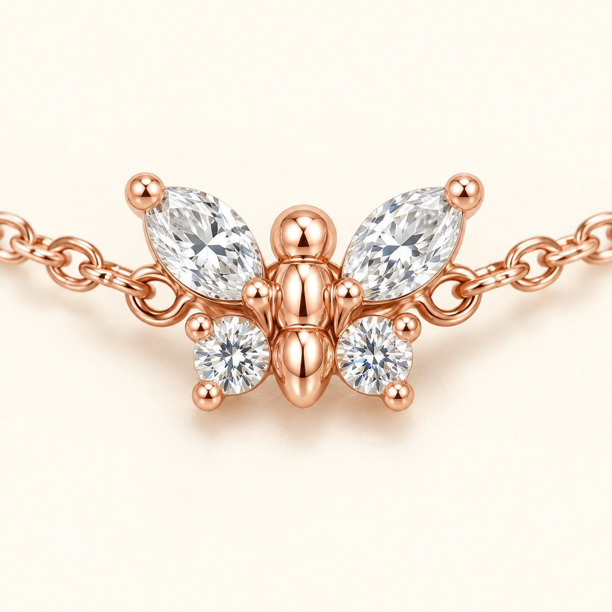 Macro view of a rose gold diamond butterfly bracelet with 3 × 1.5 mm marquise diamonds and 1.7 mm round diamonds.