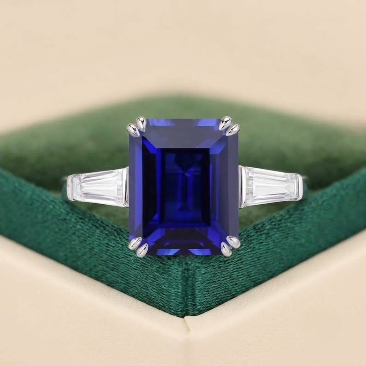 Emerald cut blue sapphire engagement ring with moissanite side stones