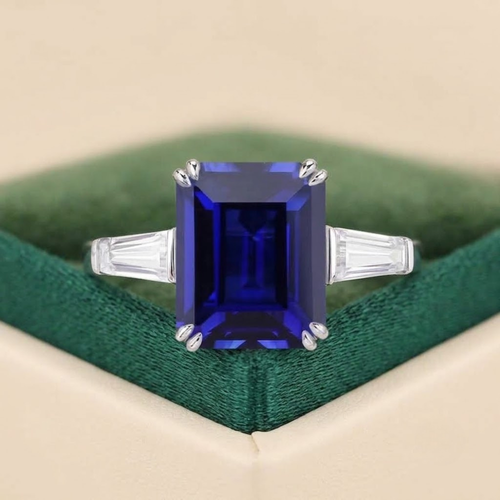 Emerald cut blue sapphire engagement ring with moissanite side stones