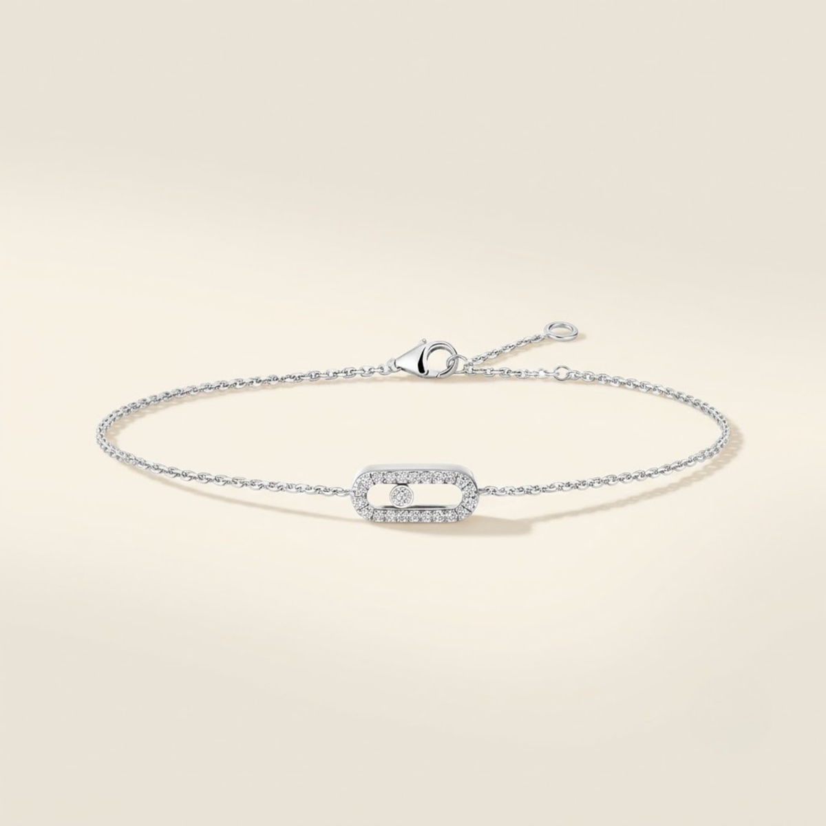 18K white gold diamond pavé bracelet with moving diamond motif on ivory background